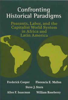 This book is blue-green with two globes, centered on Latin America and Africa, in a lighter shades of green