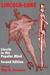Cover of book is gray with a paper cutout of Lincoln leading to an image with wings. 