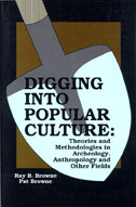 Cover of book is brown and black, with a gray and light blue shovel in the center.