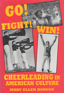 Book cover is red with yellow lettering.  There are three photos of cheerleaders.