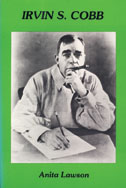 Cover of book is green with a black and white photo of a man writing.