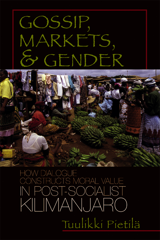 cover of Pietila's book is dark blue, with a photo of a marketplace in the center. Bunches of bananas are shown.