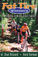 The cover of Fat Tire shows three mountain bikers on a Wisconsin trail.