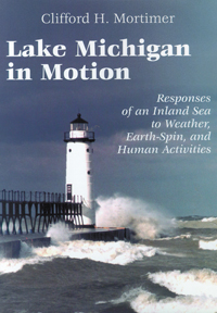 Cover features a lighthouse at the end of a pier with waves from Lake Michigan crashing against them