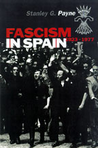 The cover of Fascism in Spain is illustrated with a black and white photo of a fascist march or demostration. There are military-style uniforms, one man wears jack-boots.