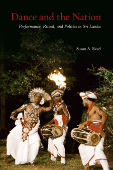 The cover  of Dance and the Nation is a dark photo of a nighttime performance of Kandyan dance. Threee men, in white wraps, turbans and jewelry, perform this dance with fire, and drums.
